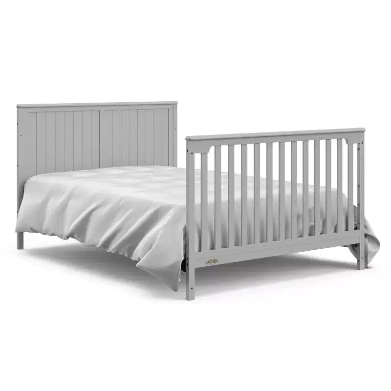 Lit de bébé évolutif avec tiroir et table à langer
