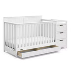 Lit de bébé évolutif avec tiroir et table à langer
