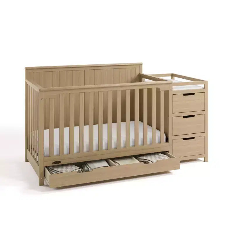 Lit de bébé évolutif avec tiroir et table à langer