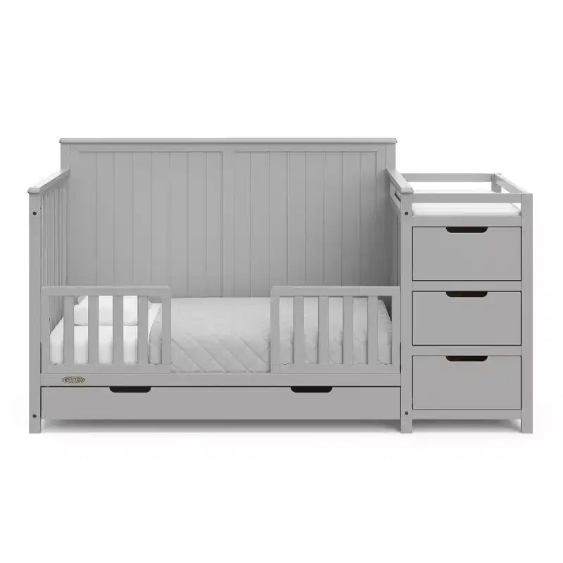 Lit de bébé évolutif avec tiroir et table à langer