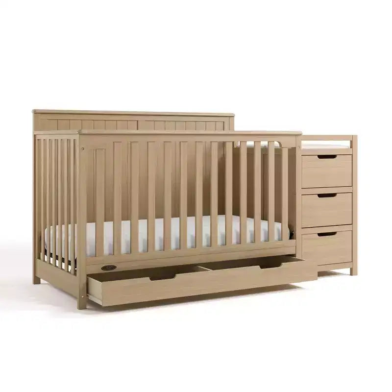 Lit de bébé évolutif avec tiroir et table à langer