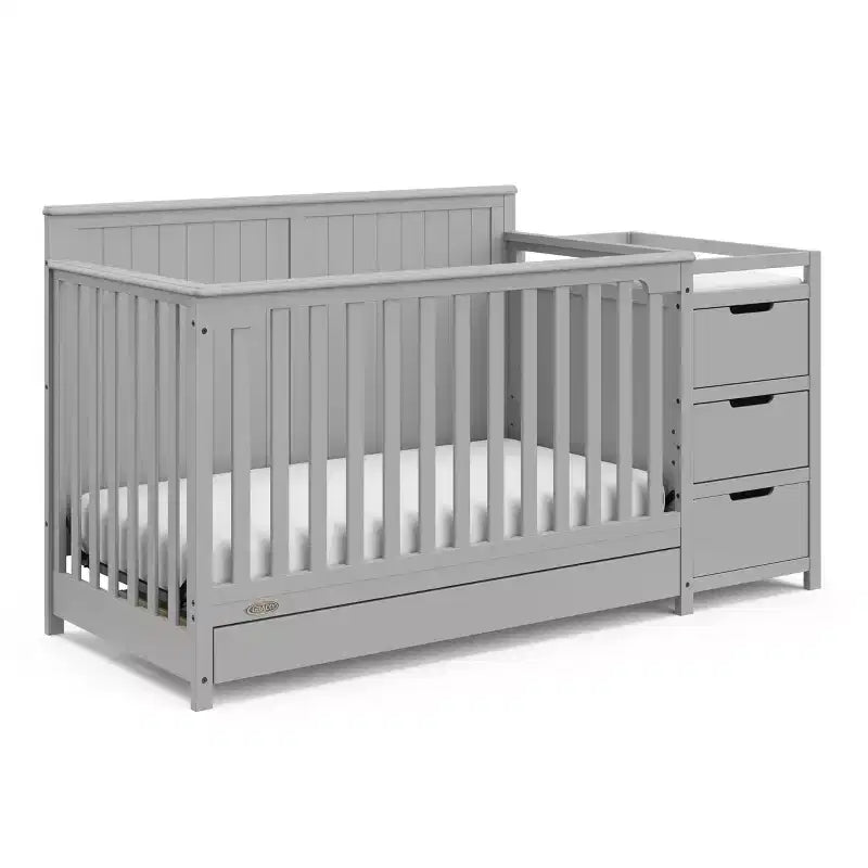 Lit de bébé évolutif avec tiroir et table à langer
