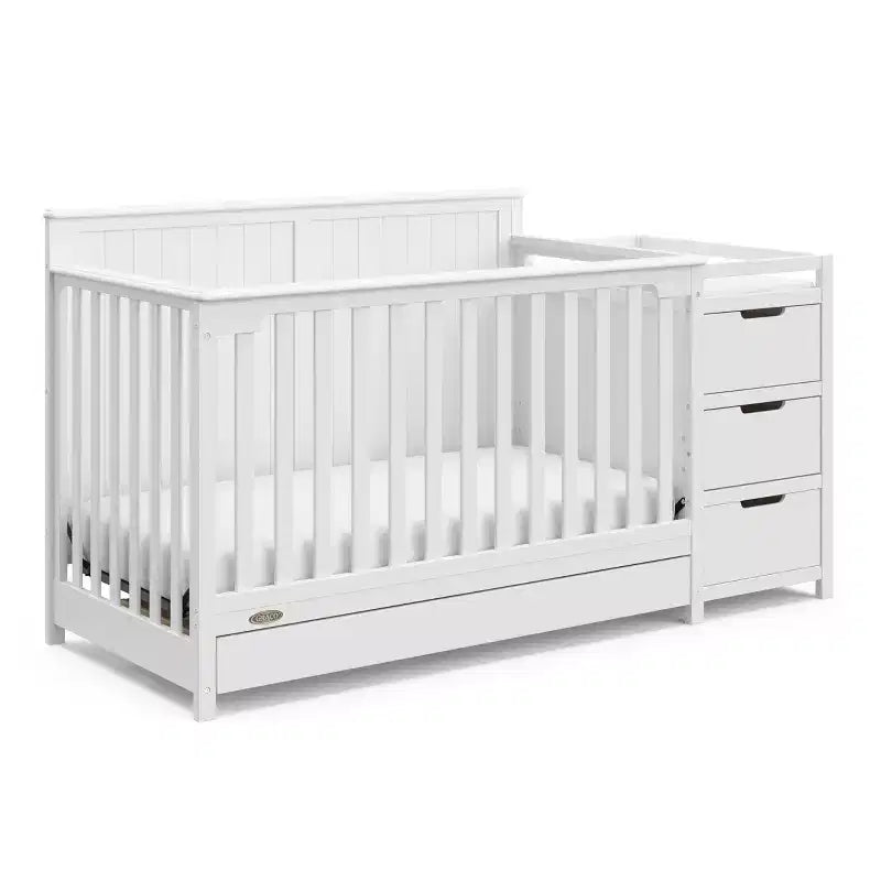 Lit de bébé évolutif avec tiroir et table à langer